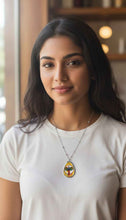 Load image into Gallery viewer, Rich and Rich Artistic Mustard Yellow Oval Necklace – Colorful Winged Guardian Pendant