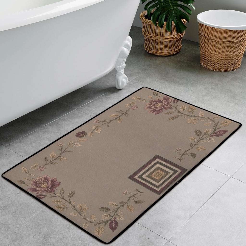 Botanical accent rug with mauve flowers and black border beside white clawfoot tub