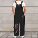 Black sleeveless wide-leg jumpsuit with red rose print and button straps — product detail