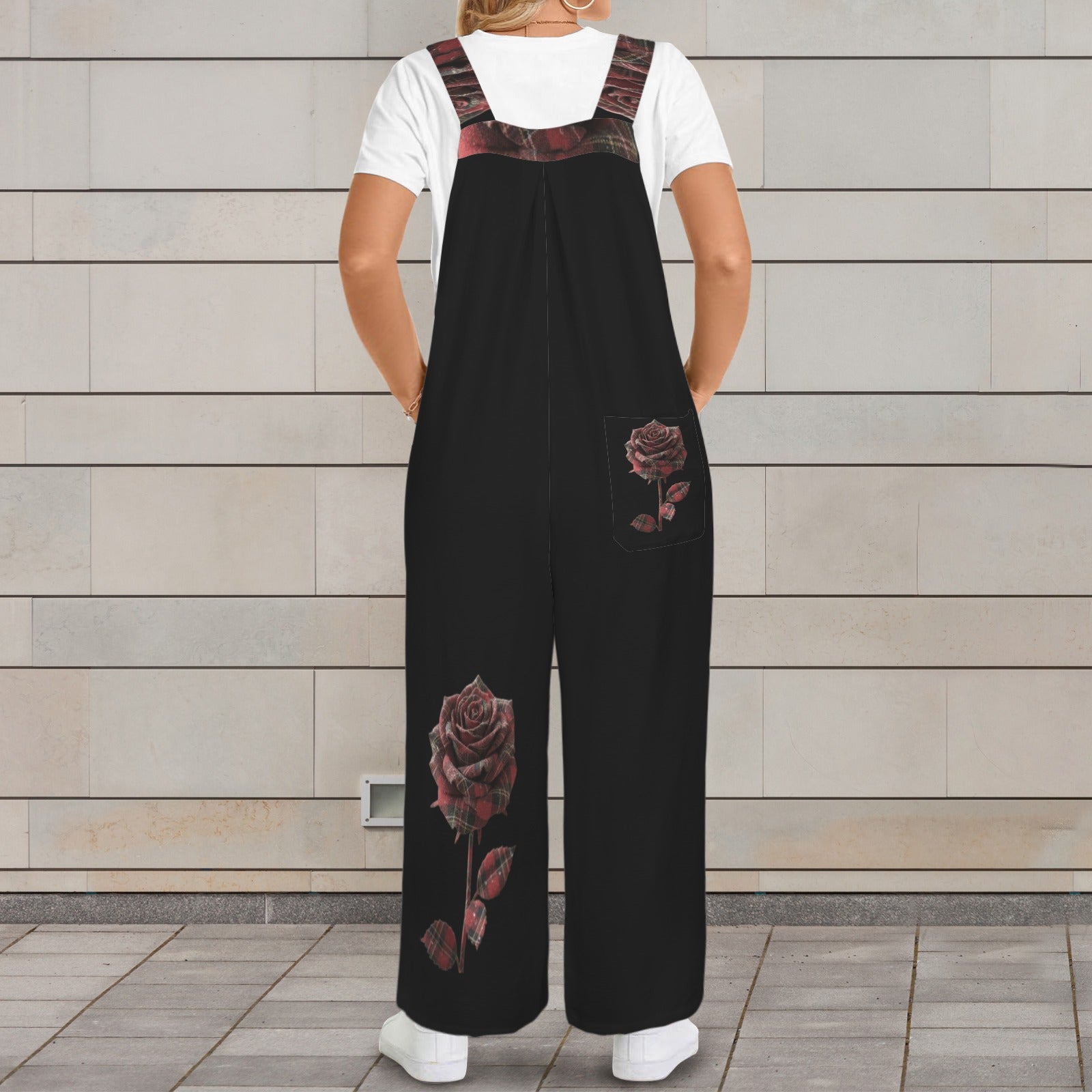 Black sleeveless wide-leg jumpsuit with red rose print and button straps — product detail