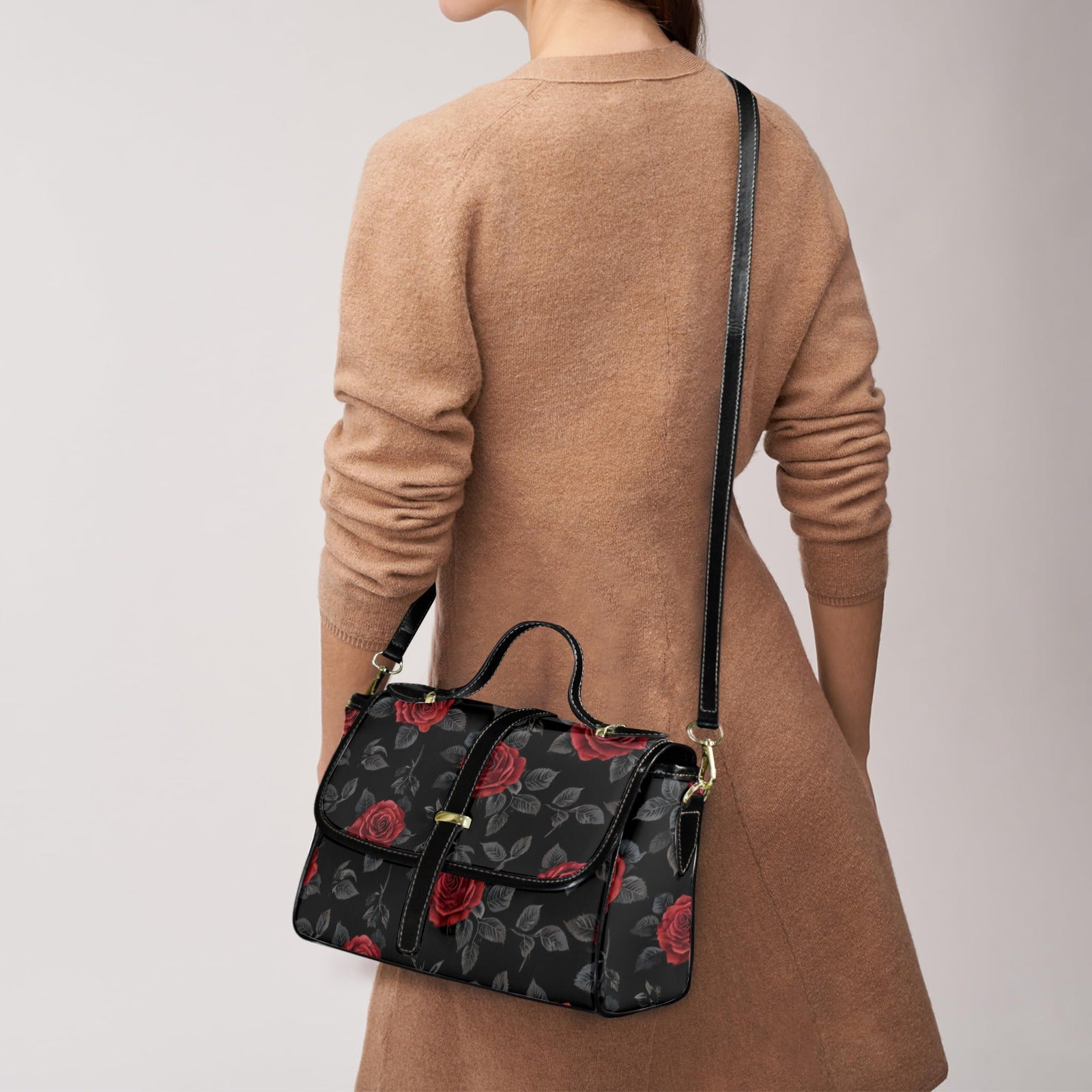 Women's red rose PU leather satchel with flap top, top handle, and adjustable shoulder strap — side view
