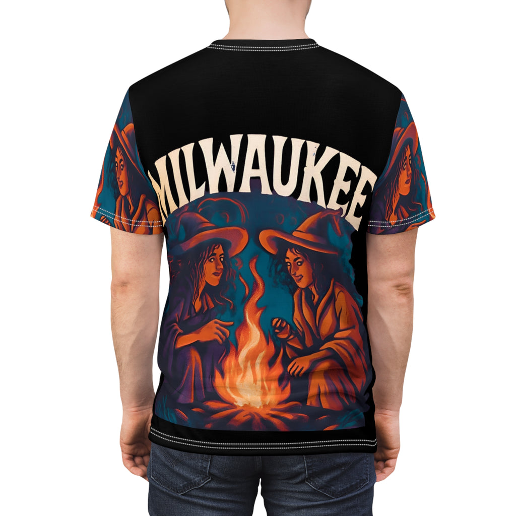 Milwaukee Witchy Vibes Unisex Tee featuring two witches by a campfire in a vintage Halloween graphic design
