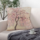 Square 18x18 faux-linen pillow with pink cherry blossom tree artwork and included core — rear view
