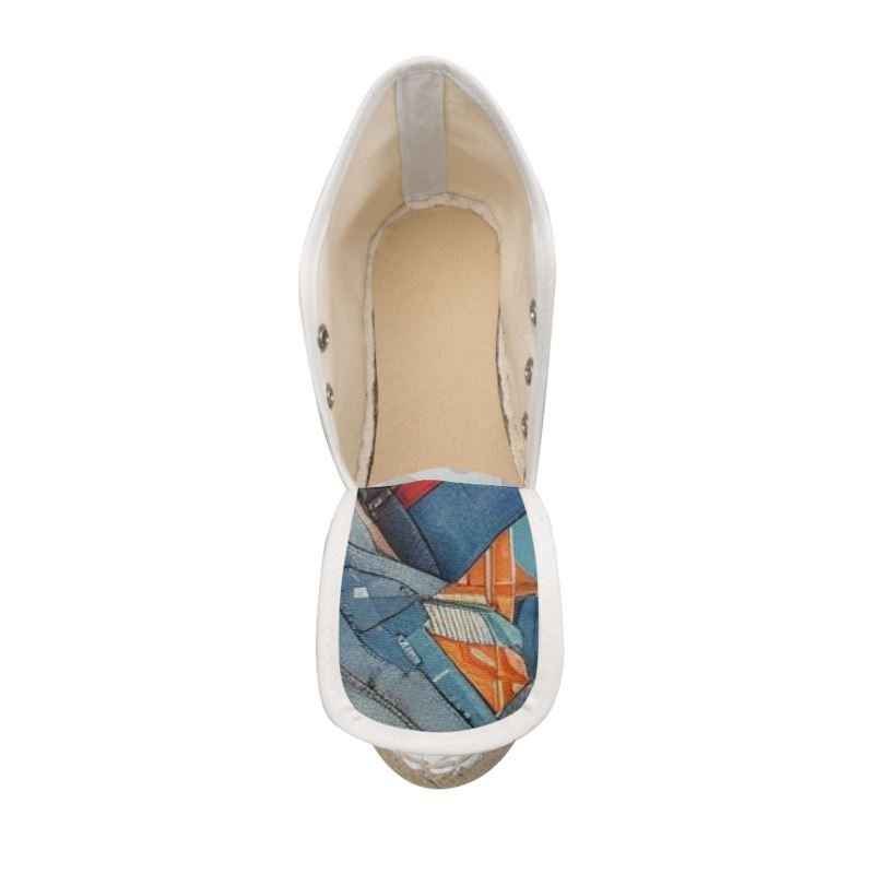 Blue geometric wedge espadrilles with jute platform and rubber sole — side view
