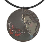 Wooden pendant necklace with graphic design on black faux suede cord and silver clasp — product detail