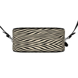 Round box shoulder bag in Nappa leather with faux suede lining and black leather piping — side view