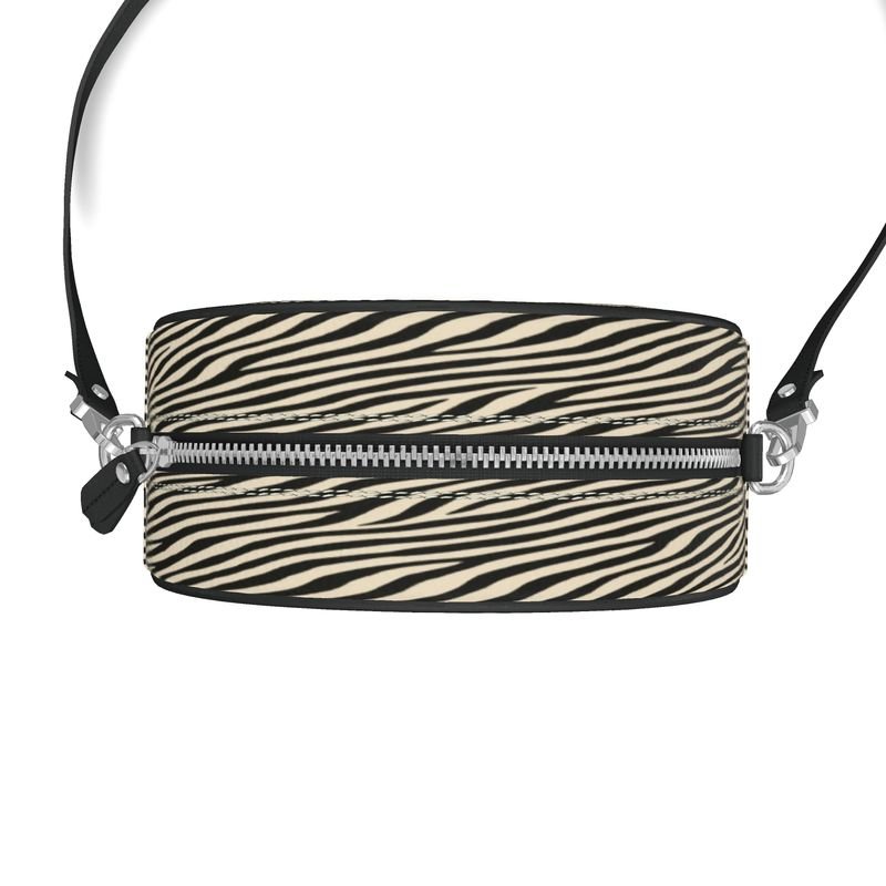 Round box shoulder bag in Nappa leather with faux suede lining and black leather piping — rear view