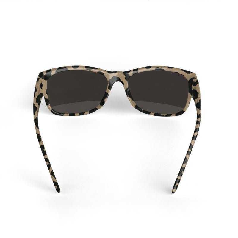 Unisex sunglasses with safari animal print frame and black temples — side view
