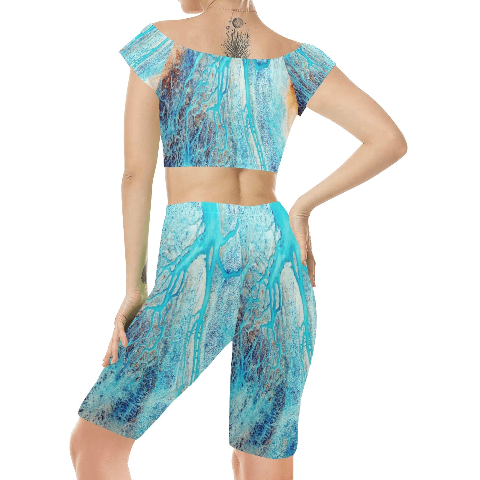 Rich and Rich Turquoise Women's Yoga Set modeled on a woman performing yoga