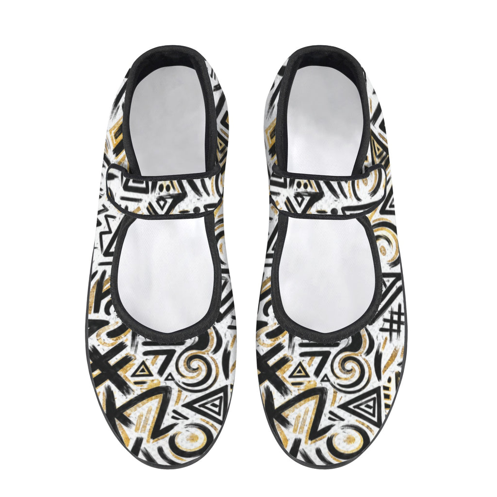 Pair of black, white, and gold patterned shoes on a white background