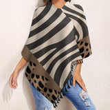 Loose women's tassel cape in smooth polyester blend with tassel trim — rear view