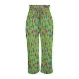 Green floral wide-leg women's pants with elastic waistband, tied belt, and side pockets — rear view