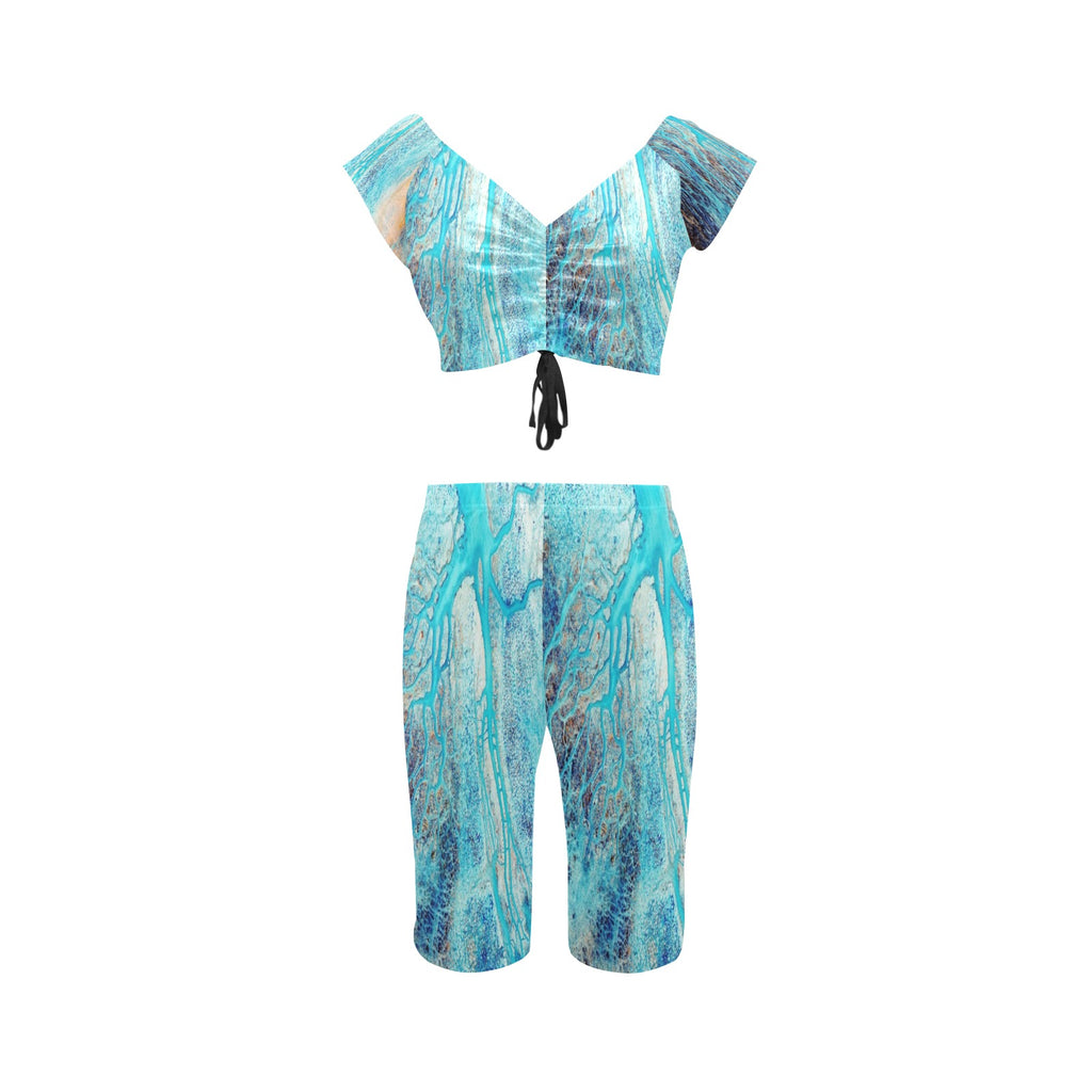 Rich and Rich Turquoise Women's Yoga Set modeled on a woman performing yoga