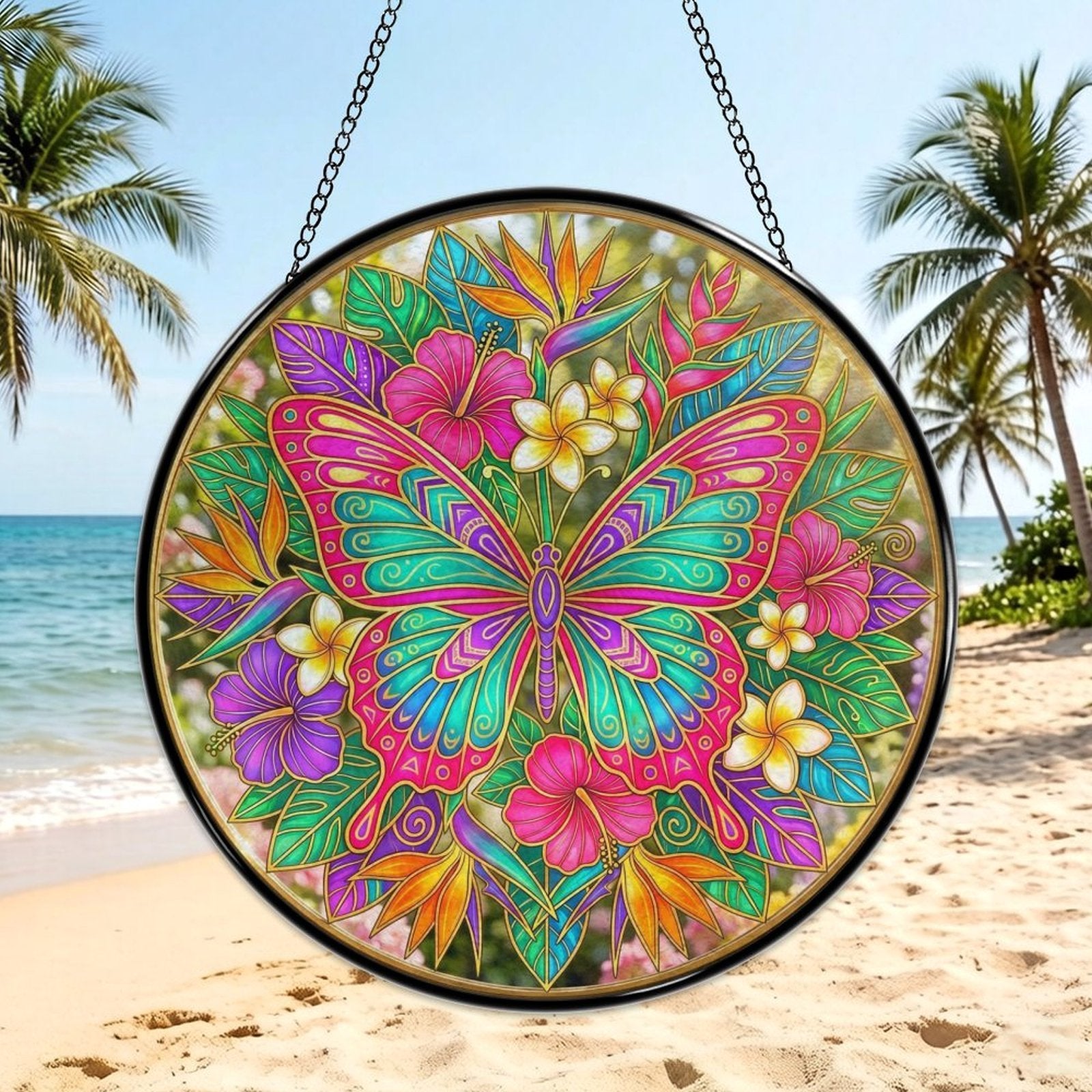 Large butterfly glass suncatcher with gold-lined wings amid pink, teal, and purple floral burst with hanging chai — side view