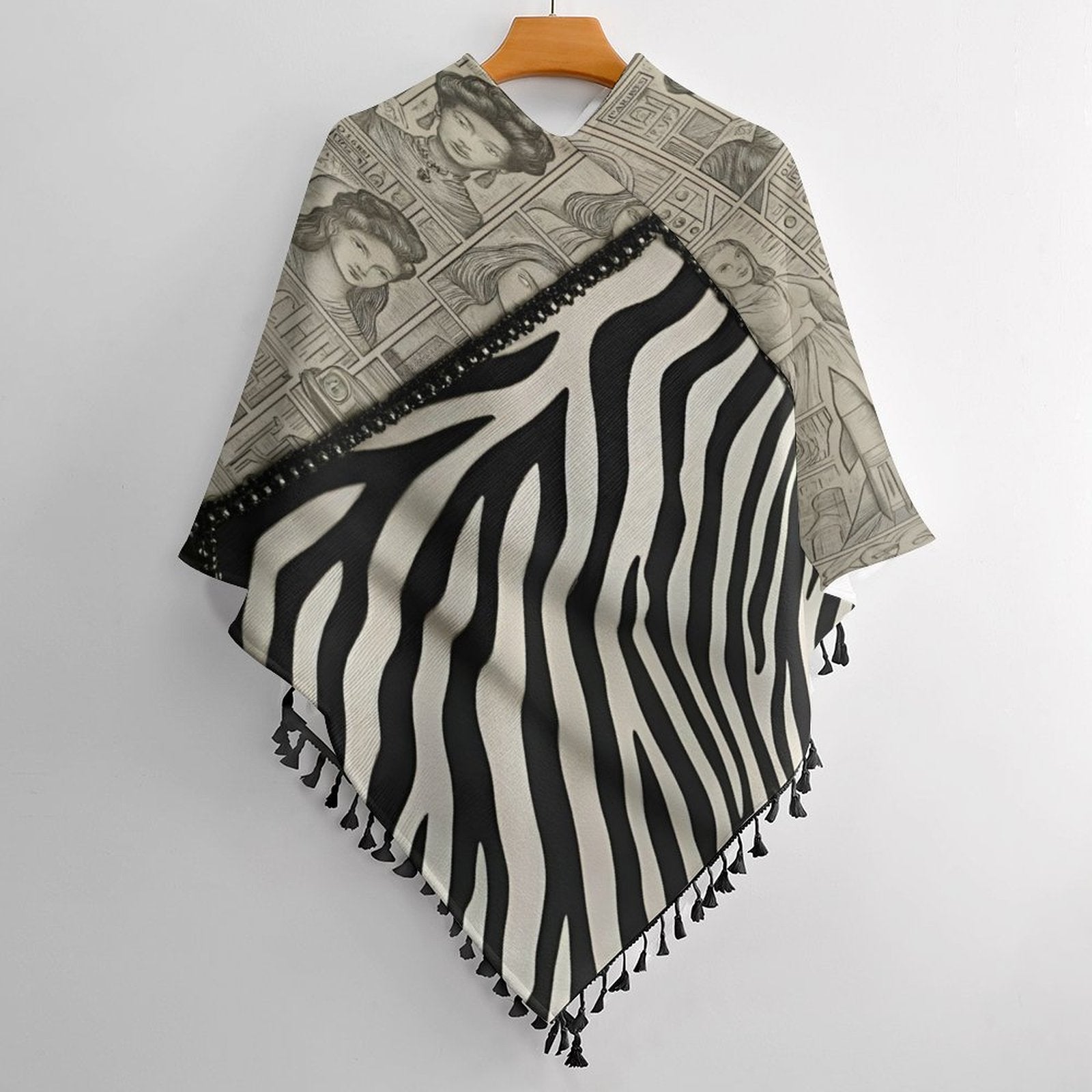 Black and beige tassel cape with loose cardigan silhouette and fringe — side view