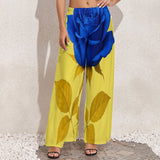 High-waist women's wide-leg pants in printed polyester with relaxed wide-leg silhouette — side view