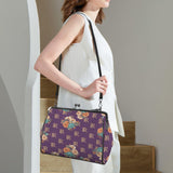 Purple floral kisslock crossbody bag in waxed PU with removable shoulder strap and top handle — additional view 8