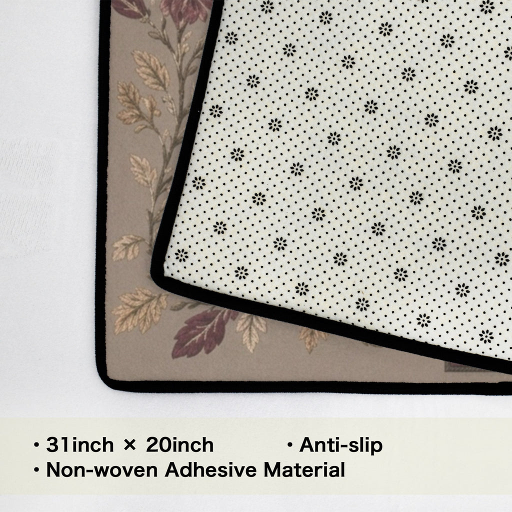 Rich and Rich beige rug with black stitched border and earth-tone geometric center