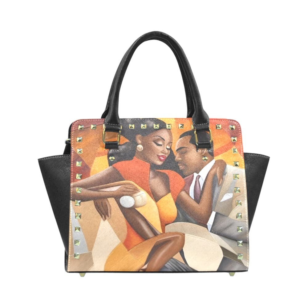 Rustic orange shoulder handbag with rivet accent, double handles and adjustable strap