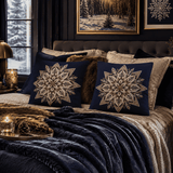 Pair of navy faux linen square pillows with white eight‑point Nordic snowflake motif