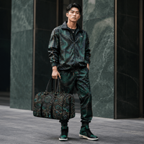 Green fractal-pattern PU leather travel duffel with top handles and adjustable shoulder strap