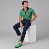 Men's green pinstripe canvas slip-on sneakers with elastic goring and rubber outsole — rear view