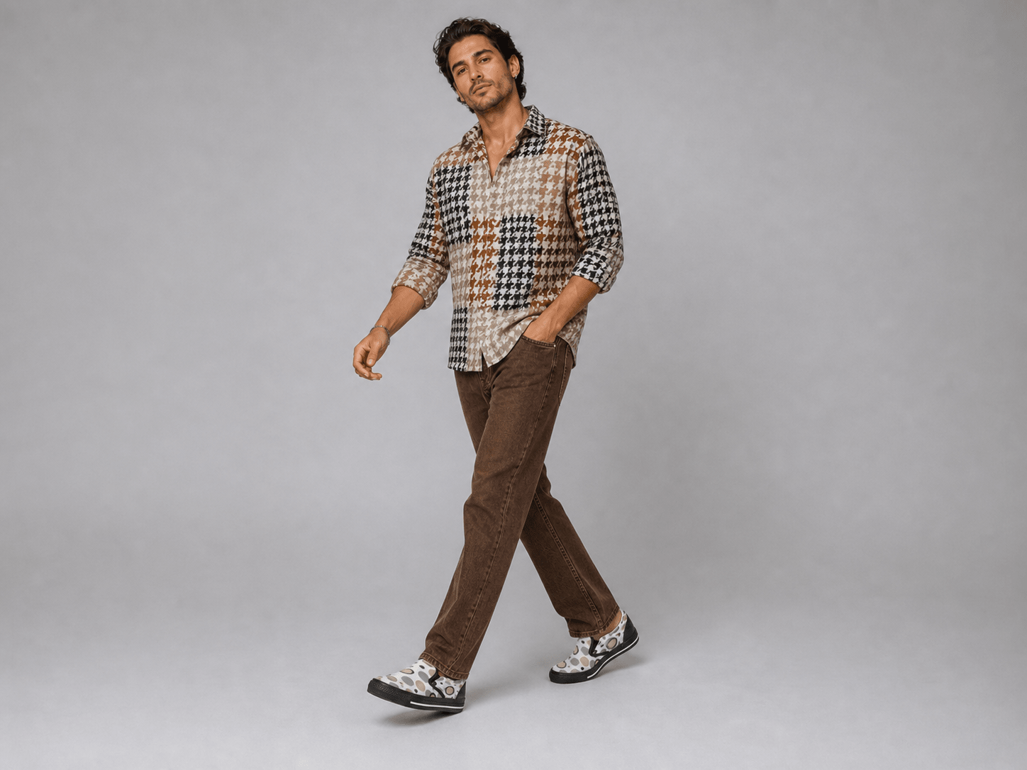 Men's beige and white canvas slip-on shoe with circular geometric pattern and elastic goring