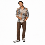 Men's beige and white canvas slip-on shoe with circular geometric pattern and elastic goring — side view