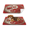 Two views of a red rectangular mat with a circular yin-yang style floral and rose pattern, shown on a white background. The top view shows the mat alone with a folded corner revealing a white underside.