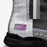 Gray and black retro high-top sneaker with leather upper, elasticated sides and pull tab — side view
