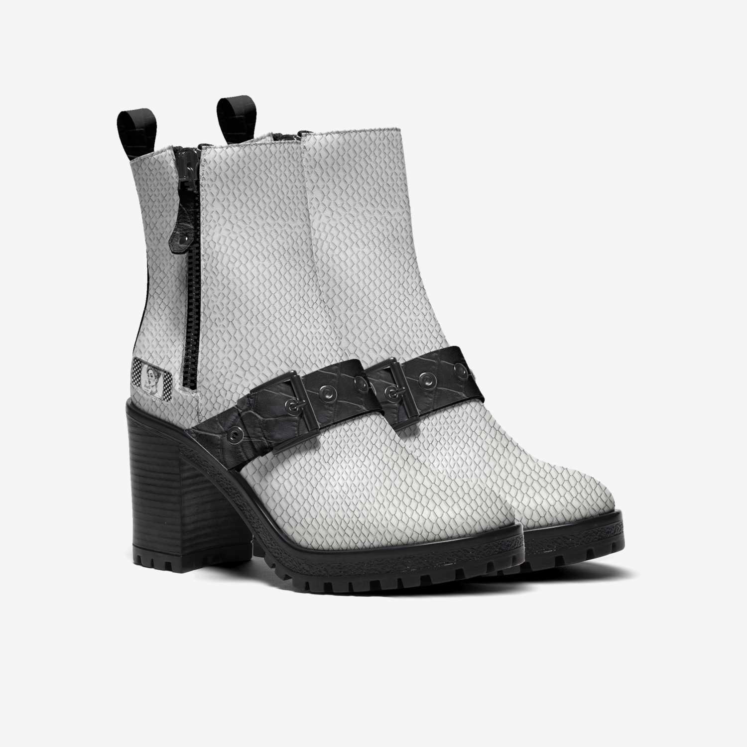 Black and white polka dot zip ankle boot with sporty mixed-material design and zip closure — side view