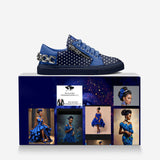 Blue low-top sneaker with metallic details, side zip and chain on the back — rear view