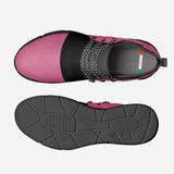 Pink leather slip-on sneakers with carved rubber sole and elasticized front panels — side view