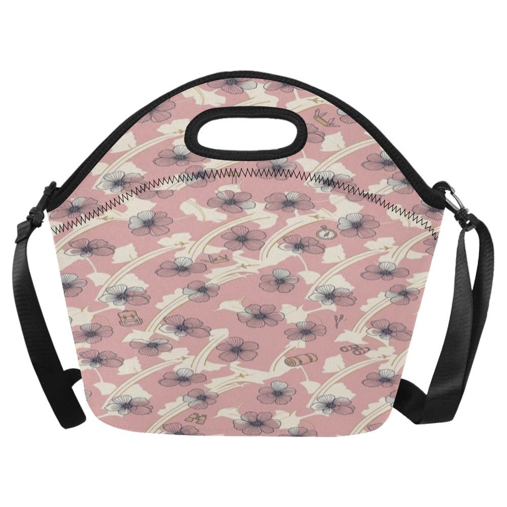 A pink neoprene lunch bag with a floral pattern, featuring a top handle, zipper closure, and adjustable shoulder straps on a white background.