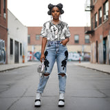 Black and white women's baseball jersey with full-button front and rounded hem in mesh fabric — side view