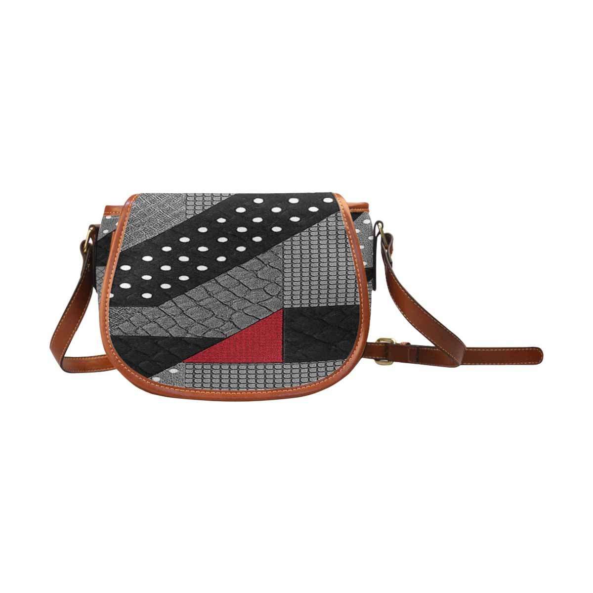 Red graphic saddle bag with gold-tone hardware and adjustable leather crossbody strap