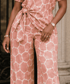 Two-piece pink giraffe print women's set with side-tie top and wide-leg pants