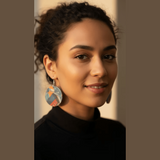 Organic-shaped wooden earrings with denim-look print and sterling silver hooks
