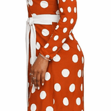 Orange polka dot long-sleeve wrap dress with V-neck and belt tie — product detail
