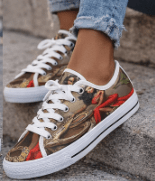 Red low-top women's sneaker with all-over caricature print and flexible rubber sole — product detail