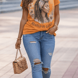 Women's orange crewneck T-shirt with Rooted in Grace graphic print