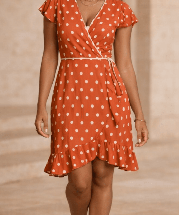 Orange polka dot women's tea dress with flounce hem and waist tie