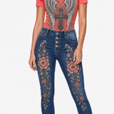 Coral tee with silver angel wings and gothic cross paired with embroidered denim jeans — additional view 7