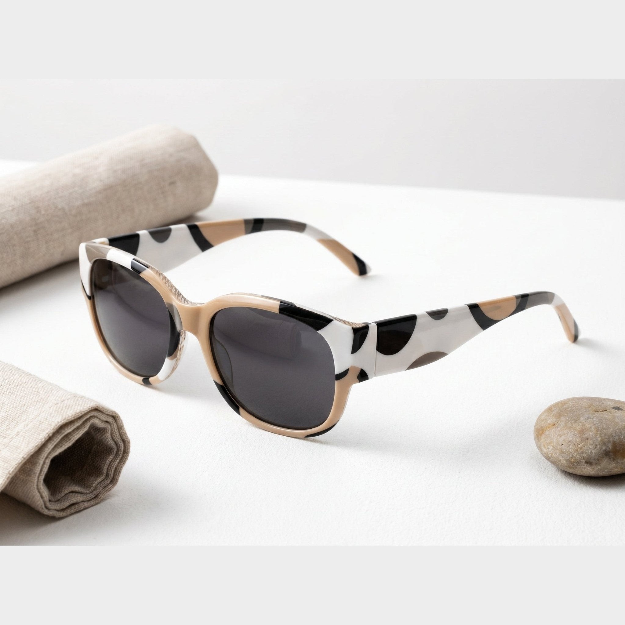 Round unisex sunglasses with earthtone circular dimension print and slim arms — rear view