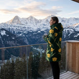 Women's emerald green puffer coat with yellow tulip floral print and detachable hood — alternate view