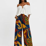 Women's blue multicolor pants set with off-shoulder V-neck top and navy blazer — additional view 8