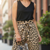 Brown animal print wide-leg women's pants with elastic waistband, tied belt, and side pockets