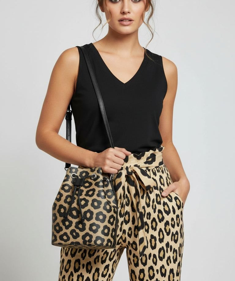 Black women's V-neck sleeveless tank top with chest pockets and side slits