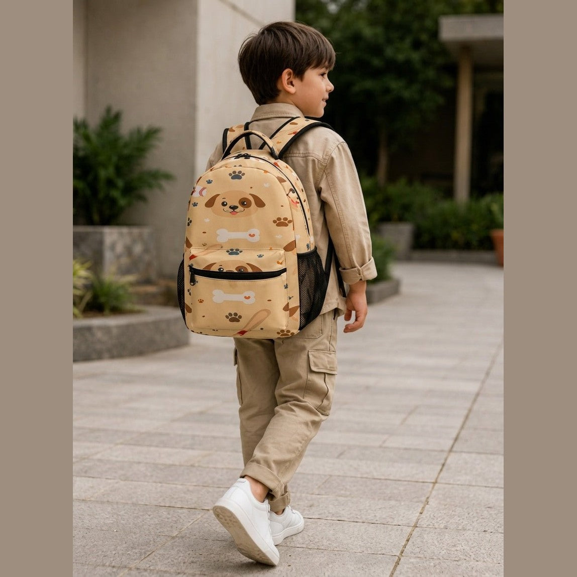 Boy walking away wearing beige dog and baseball patterned backpack