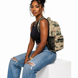 Beige 17-inch backpack with front pocket, mesh side pockets, padded straps, and orange buckle detail — product detail